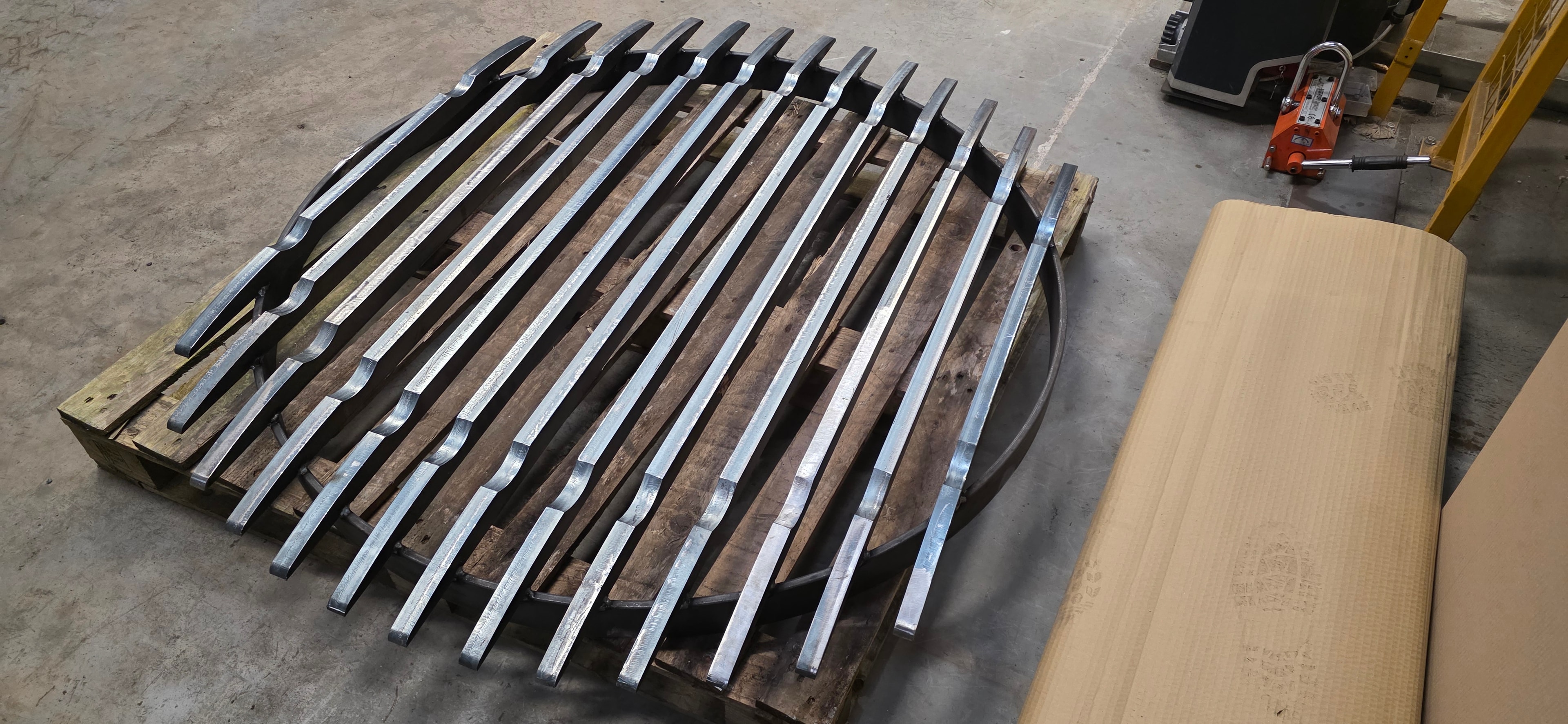 Press brake bent steel components on pallet