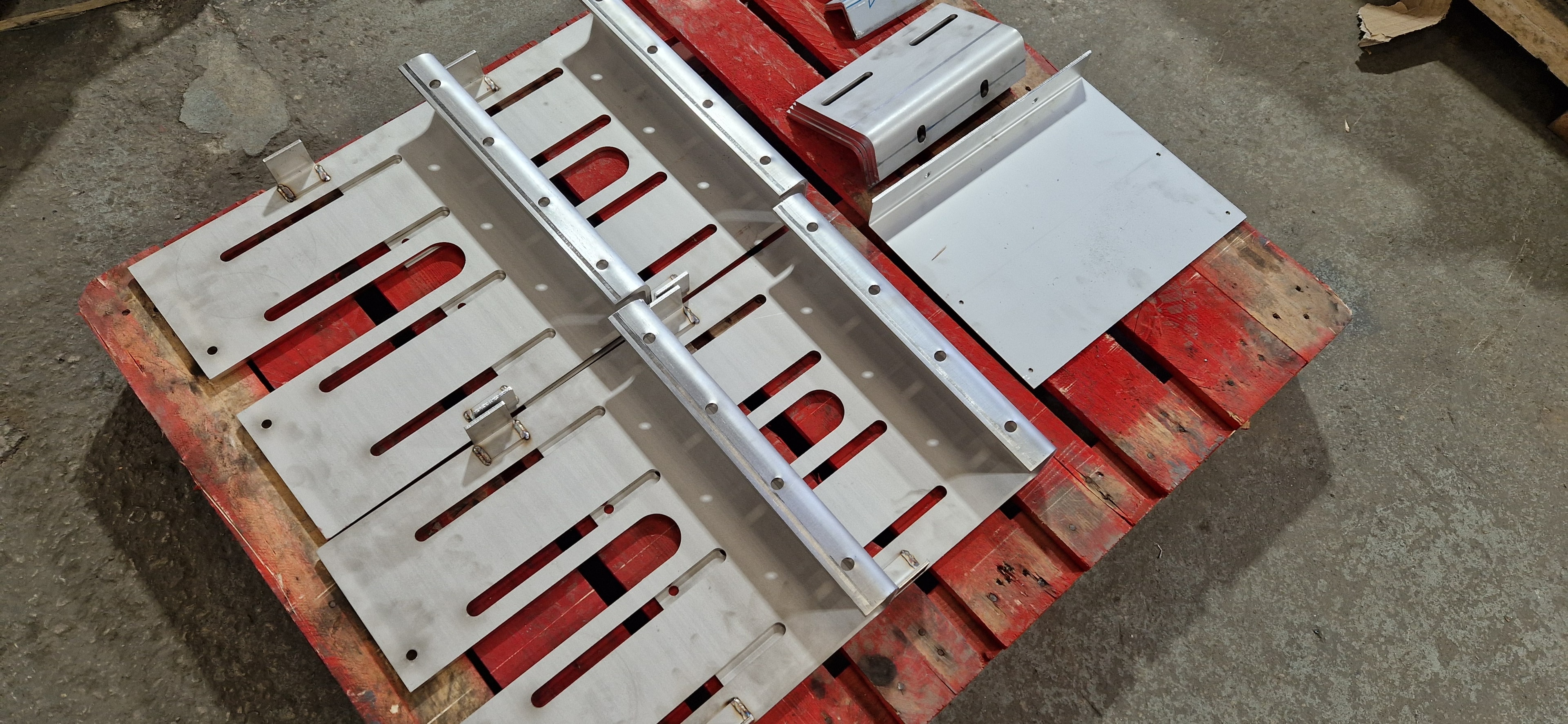 Laser cut and press brake formed aluminium components on pallet