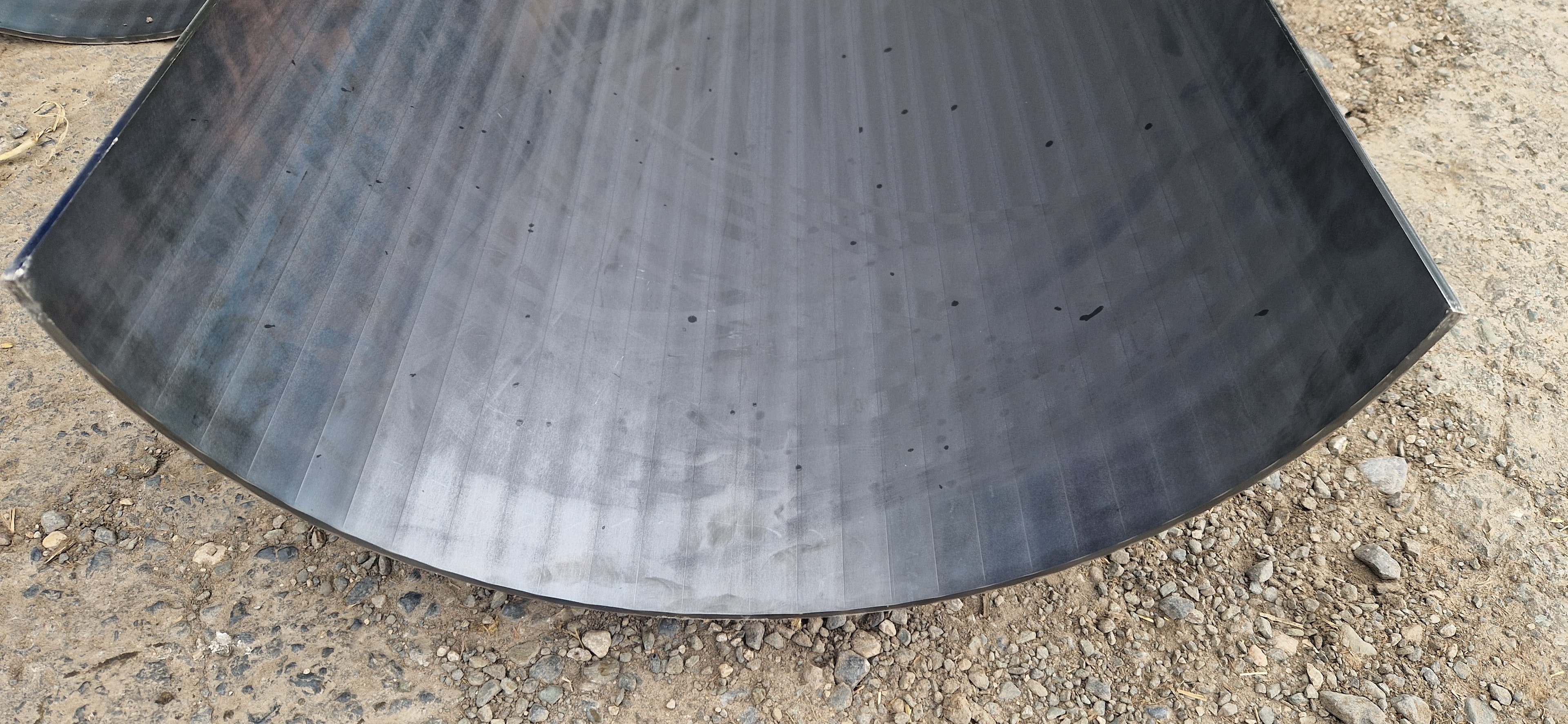Large press brake formed curved steel sheet
