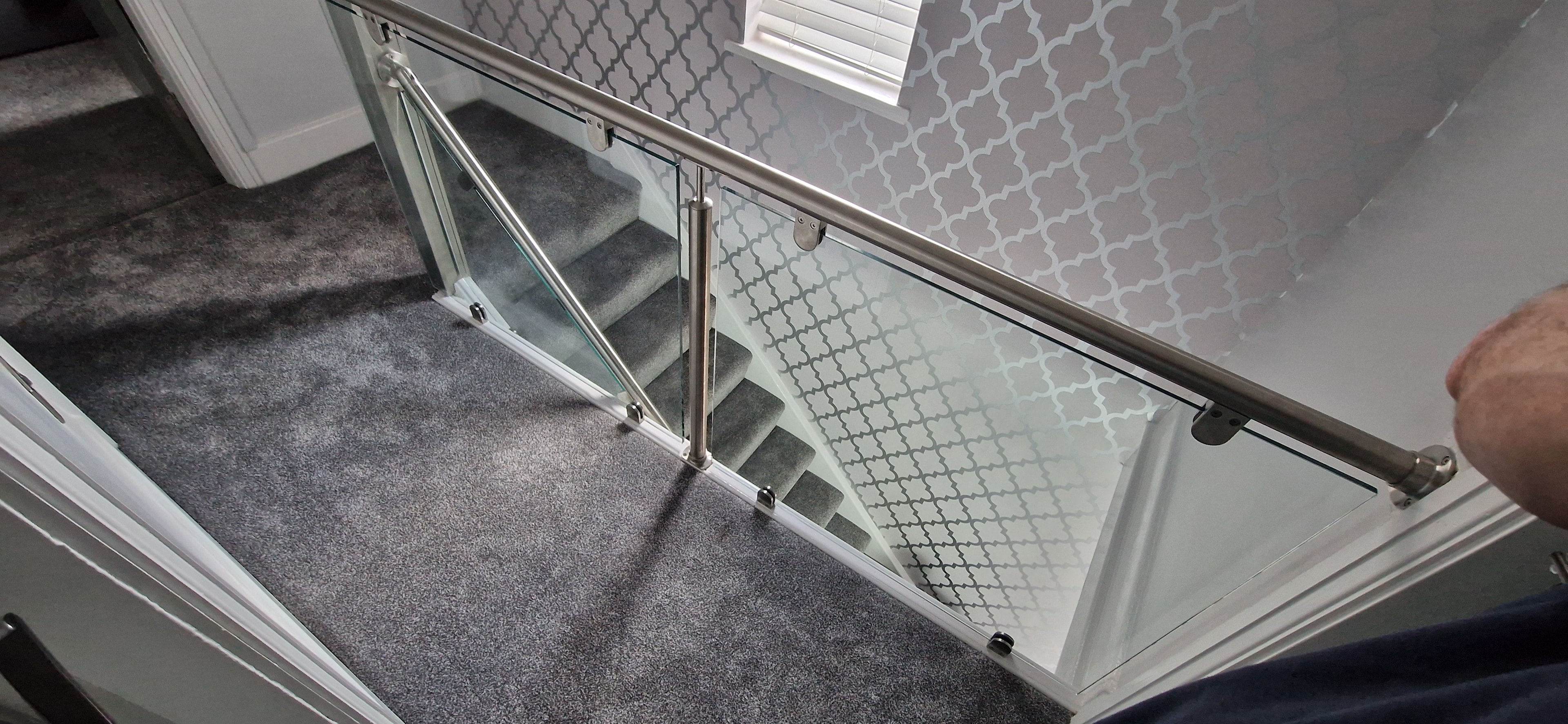 Stainless steel and glass staircase balustrade installation