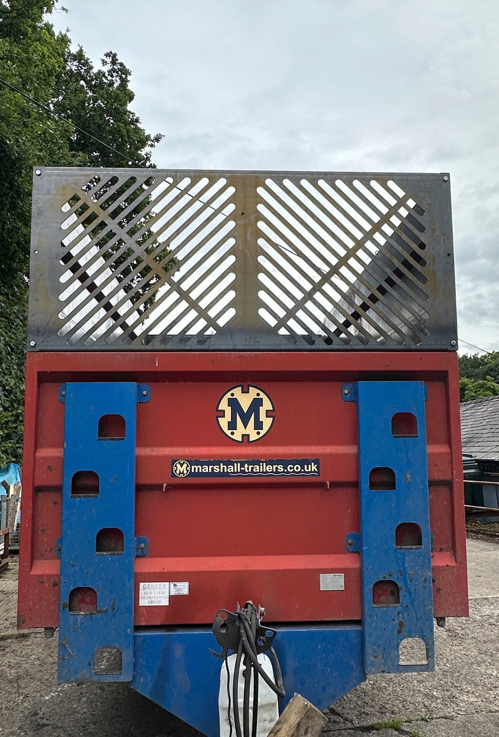 Agricultural trailer with fabricated steel body extensions